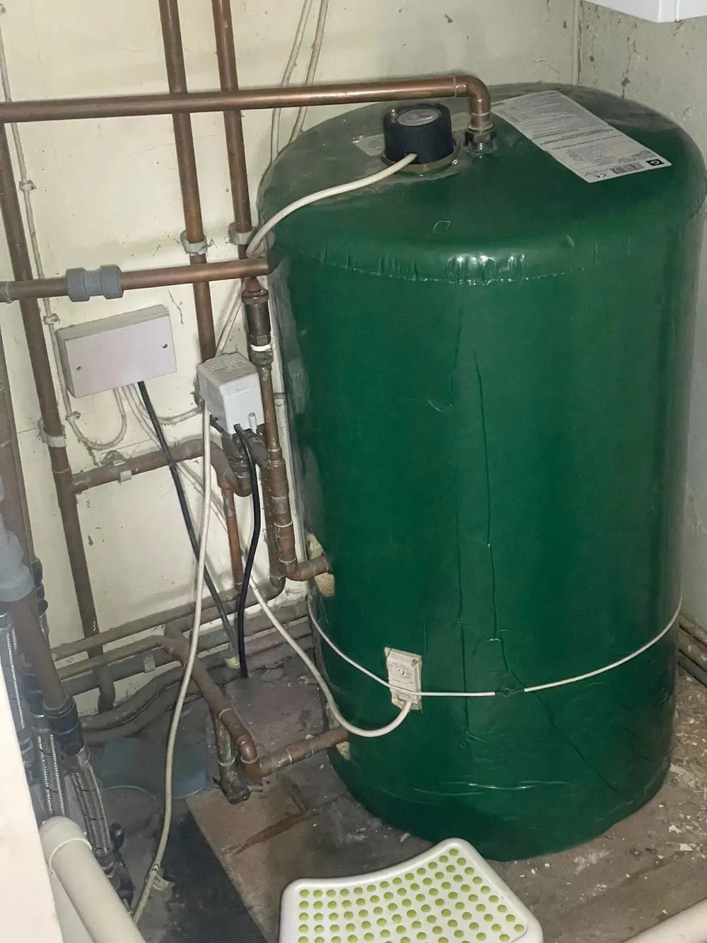 Green insulated hot water cylinder with tidy copper pipework